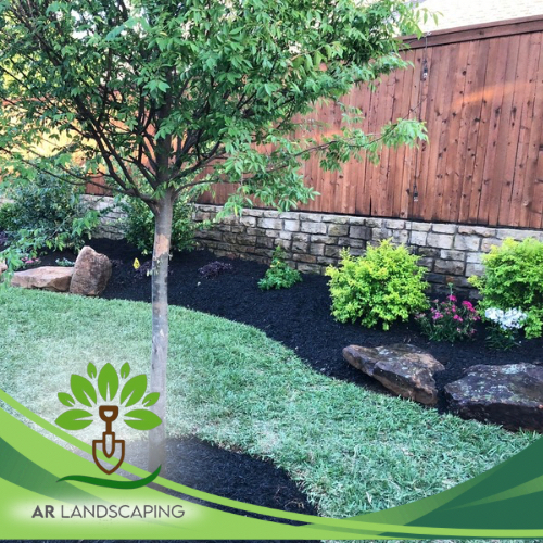 Backyard stone wall landscaping